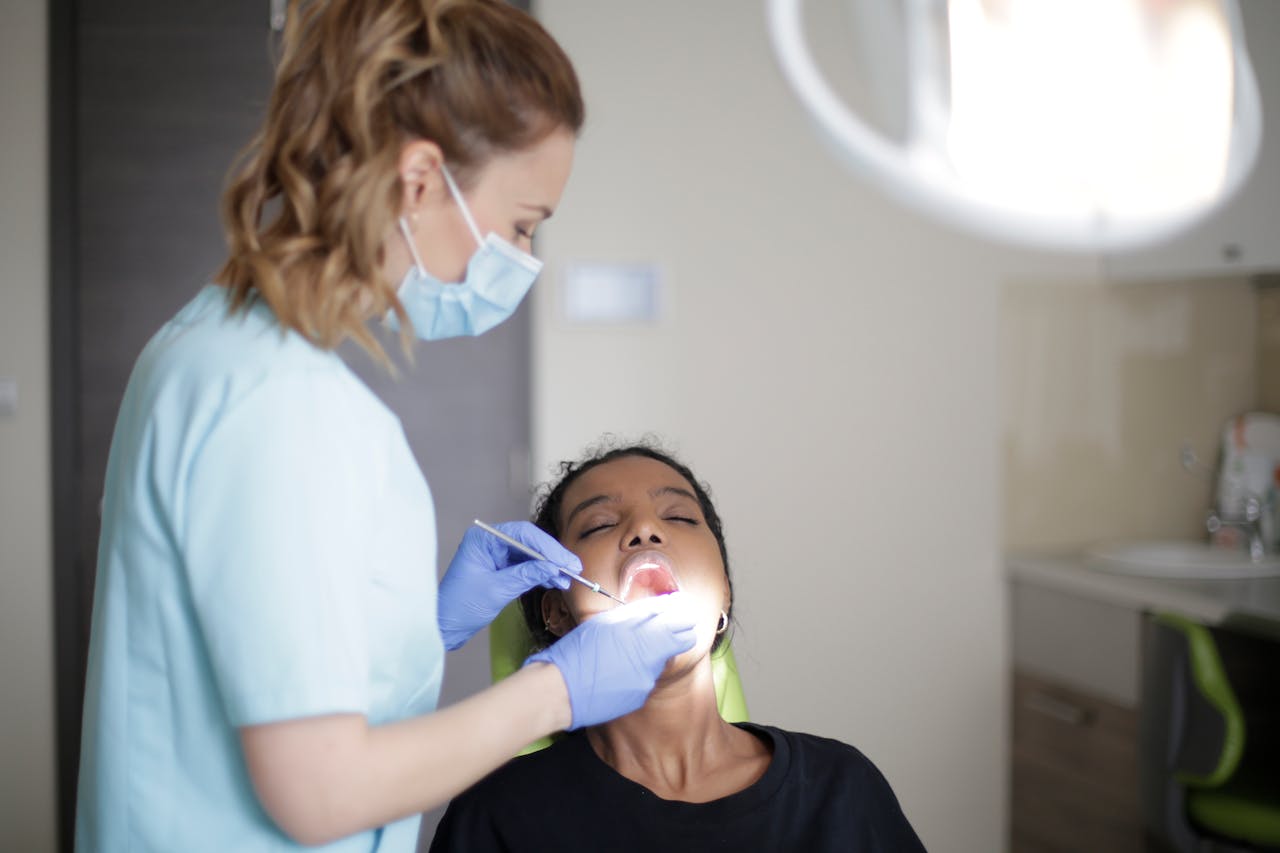A dentist examining a patients teeth in a modern dental clinic.